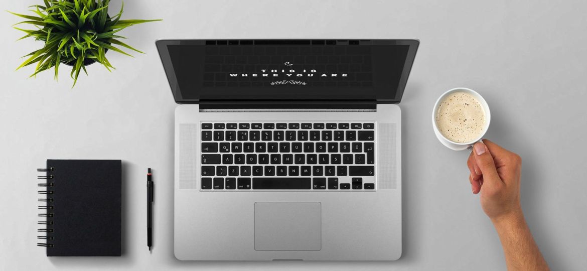 man-using-laptop-on-table-against-white-background-257897.jpg